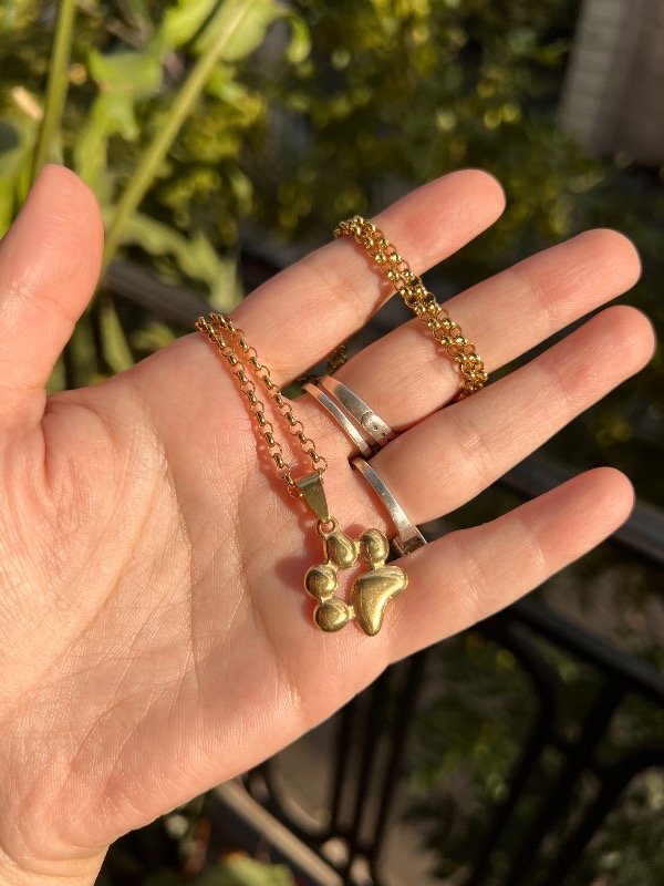 Producto - 2 Collares de acero dorado rolo con patita