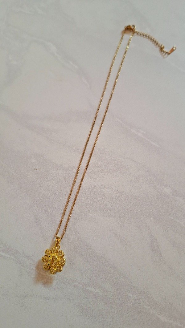 Producto - Cadena de Acero dorado con dije giratorio Flor I