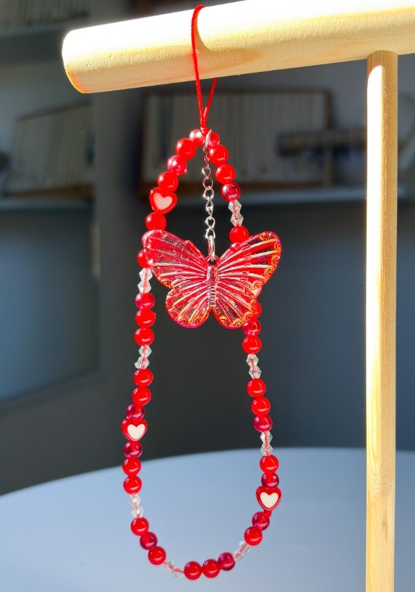 Producto - STRAP PHONE ROJO MARIPOSA