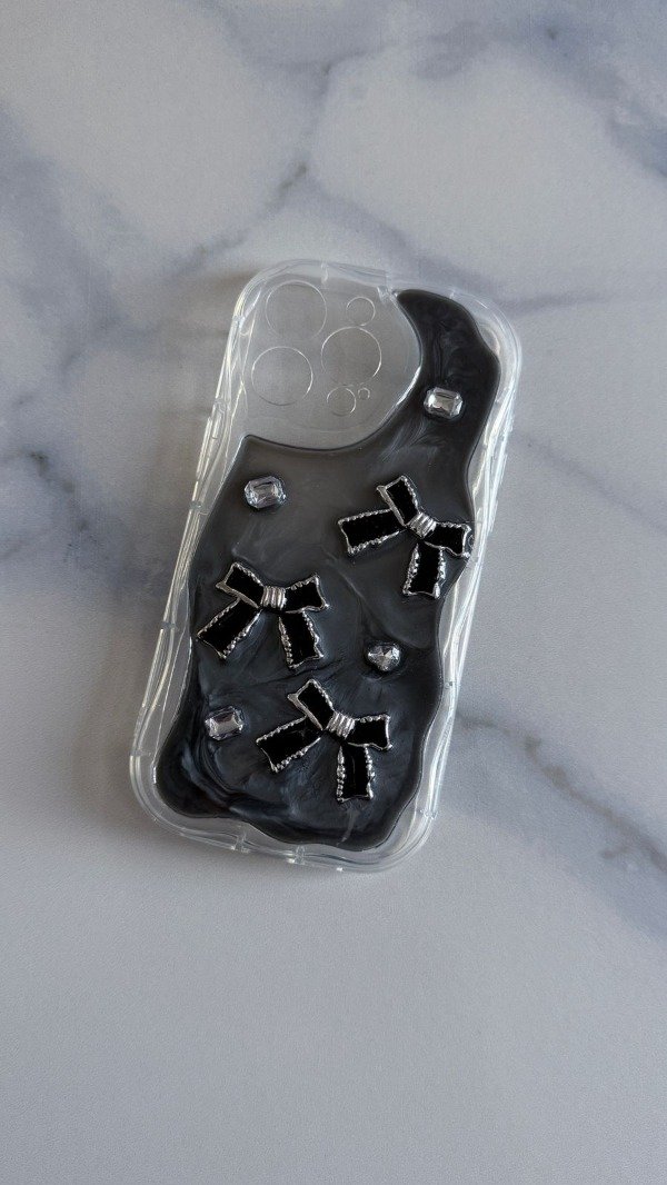 Producto - Funda moñitos negro Iph 15 pro max