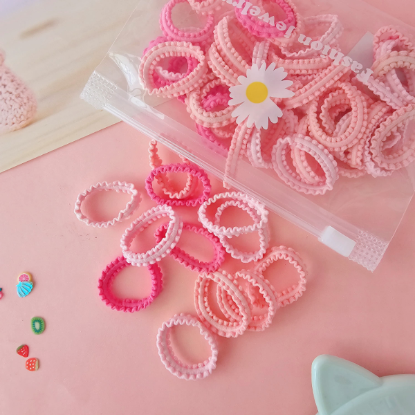Producto - Pack 50 colitas rosas