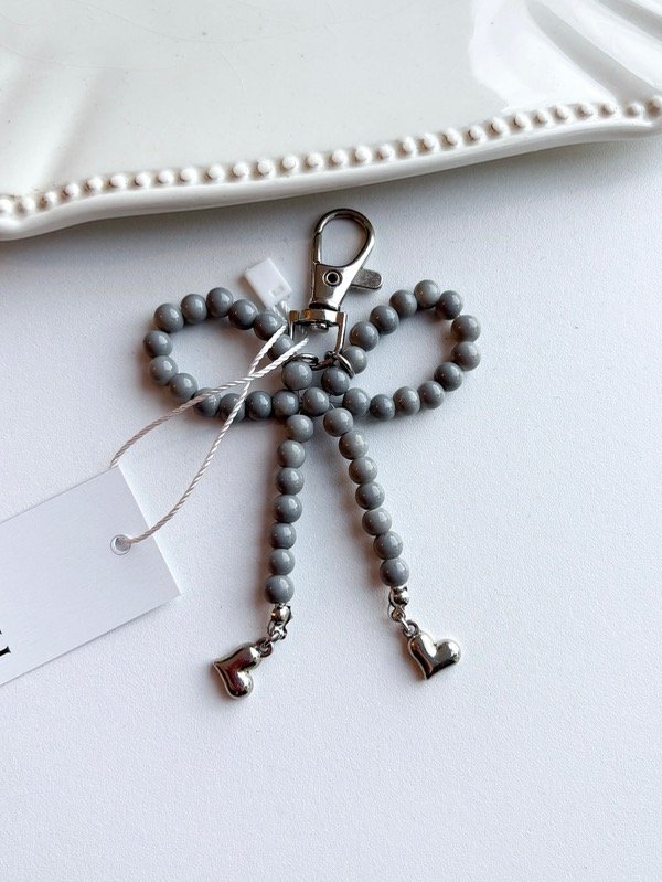 Producto - Bag charm coquette (Gris)