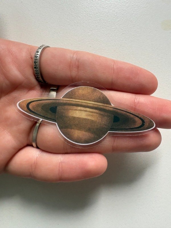 Producto - sticker saturno dorado