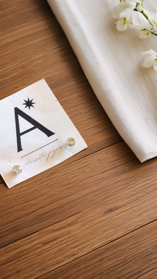 Producto - Aritos pasantes piedra redonda laminados en plata A373