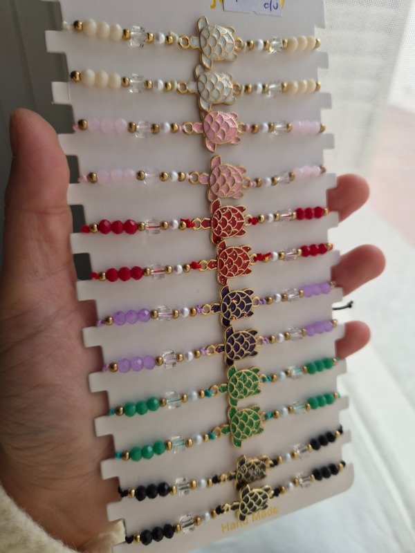 Producto - Pulseras tortugas colores regulables hilo