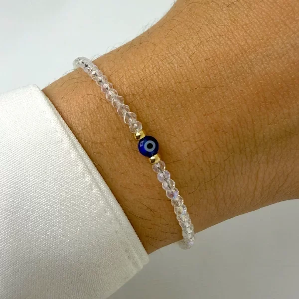 Producto - Pulsera Dorada con piedritas tornasol + mini ojito turco