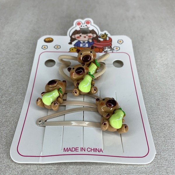 Producto - Pack de broches y colitas de capibara III