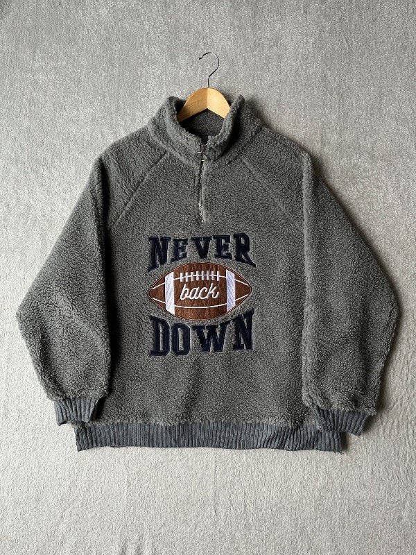Producto - 1/4 ZIP SHERPA NEVER DOWN GRIS (M)