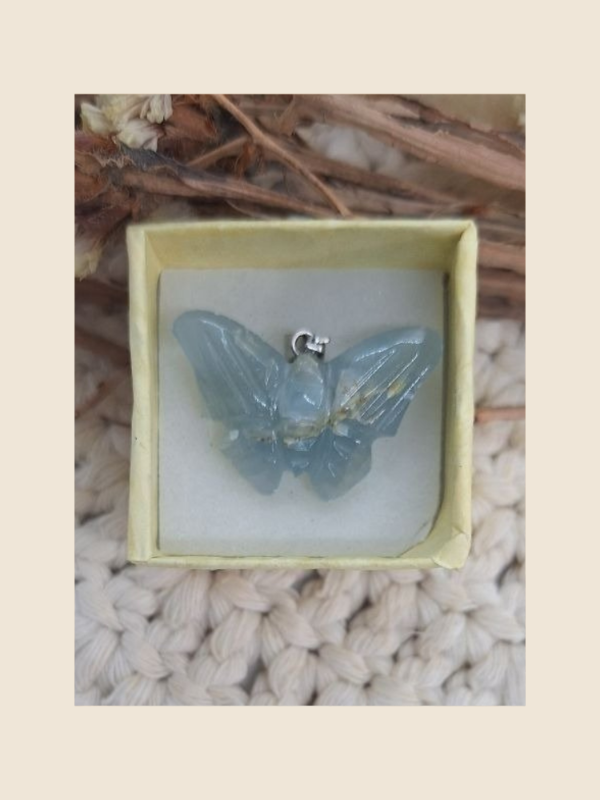 Producto - Dije mariposa onix cielo