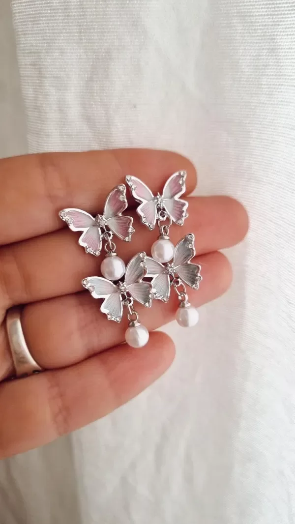 Producto - Aros mariposas doble color con perla colgante aq