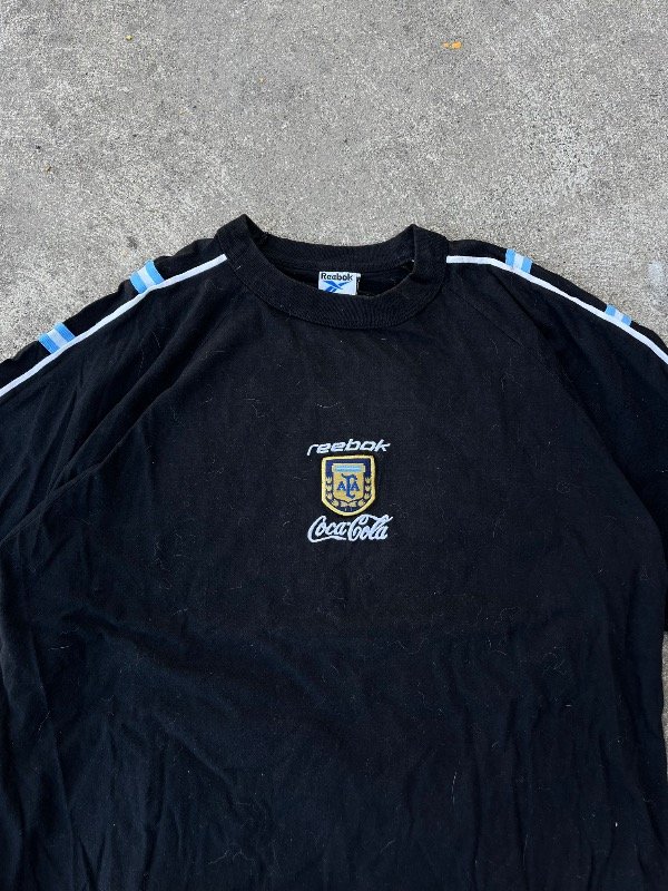 Producto - REMERA REEBOK ARGENTINA