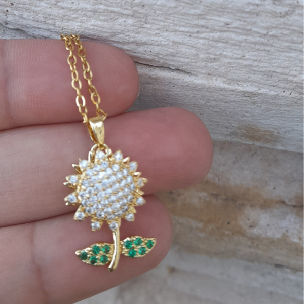 Producto - Collar giratorio flor