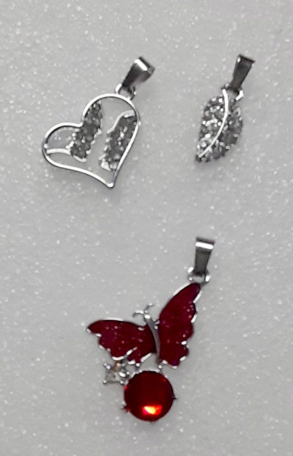 Producto - Dijes modelos surtidos DNB 1/26