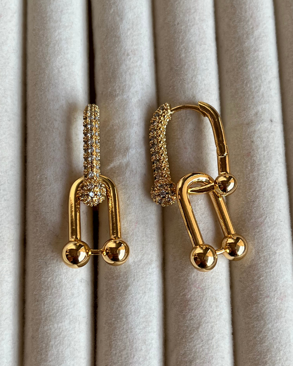 Producto - Aros con dije eslabón de acero dorado