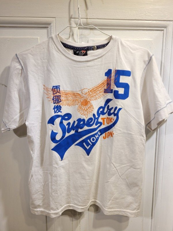 Producto - Remera POSTO5 blanca logo superdry Talle 14 años - PRECIO: 8X