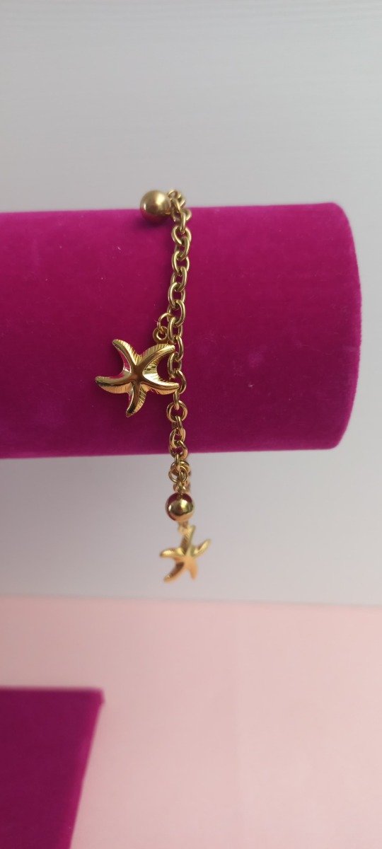 Producto - Pulsera estrellas de mar en acero dorado 18cm