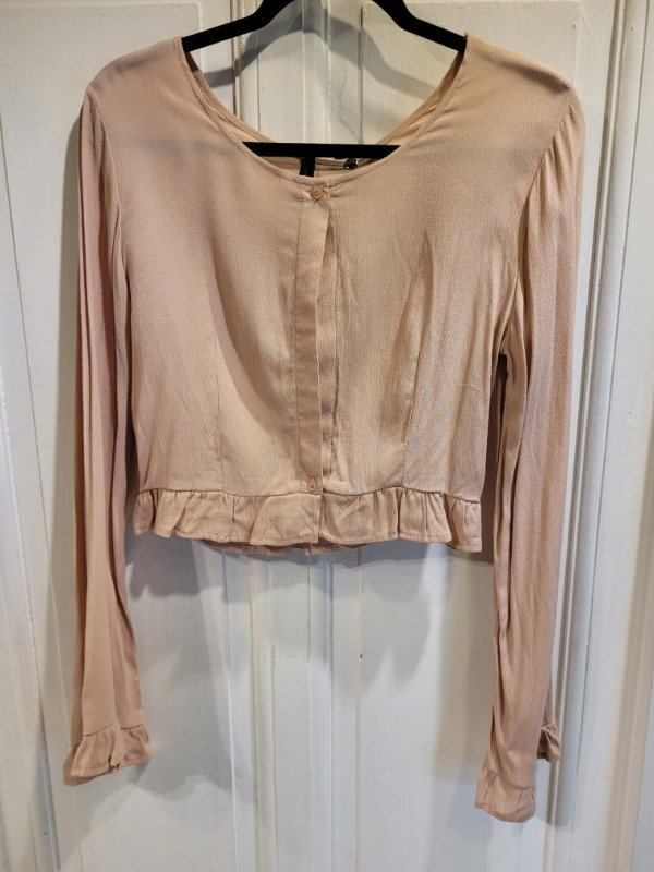 Producto - Remera INVERSA rosa viejo con abertura adelante Talle M - PRECIO: 44X