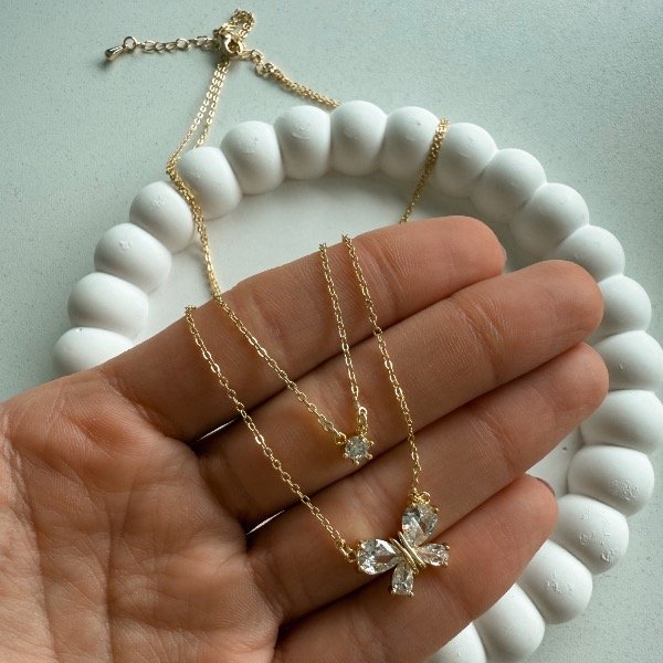 Producto - Collar doble stras con mariposa - acero dorado