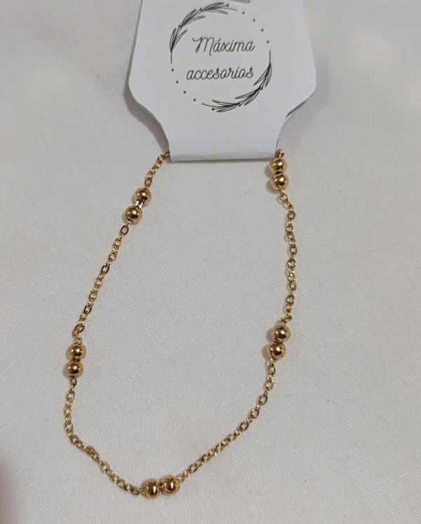 Producto - Pulsera dorada pelotitas