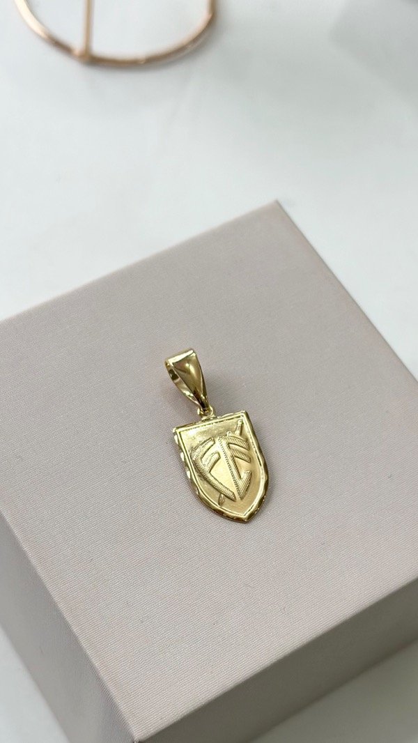 Producto - Dije fé escudo laminado en oro 18k