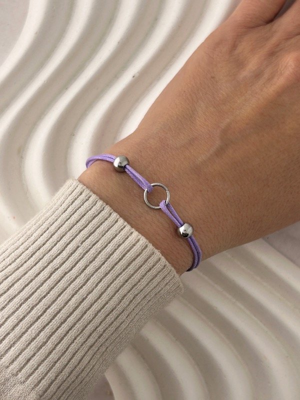 Producto - PULSERA DE HILO LILA CON BOLITAS 2010