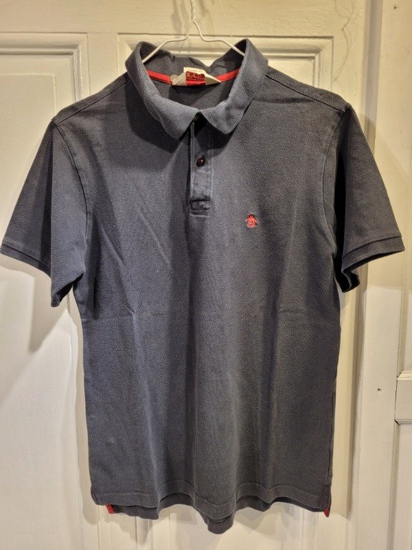 Producto - Chomba PENGUIN negra EN SALE Talle M - PRECIO: 18X