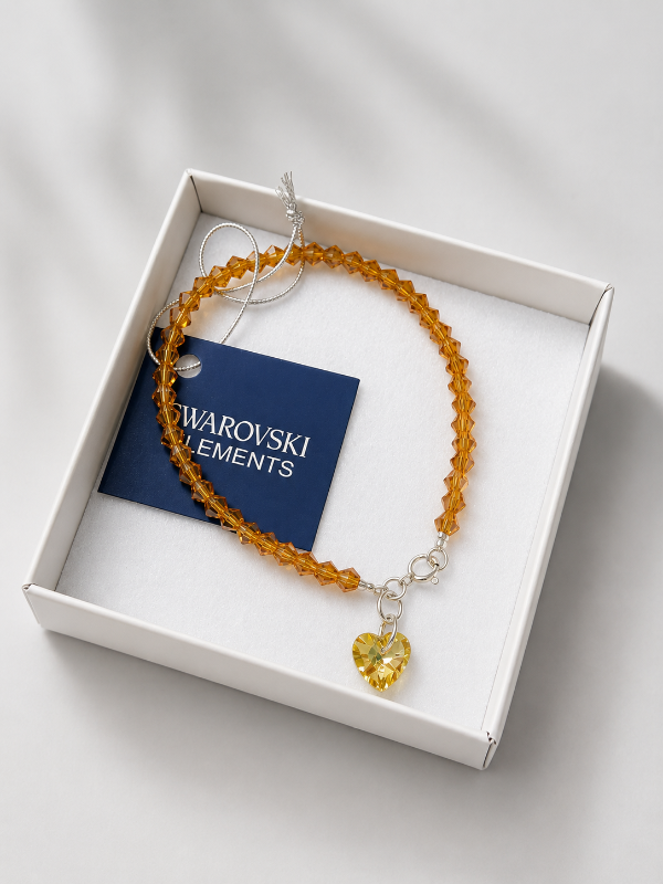 Producto - Pulsera cristal Swarovski color marrón claro con dije corazón