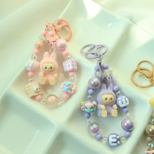 Producto - LLAVEROS STRAPS CHARMS CON PERSONAJE C4306