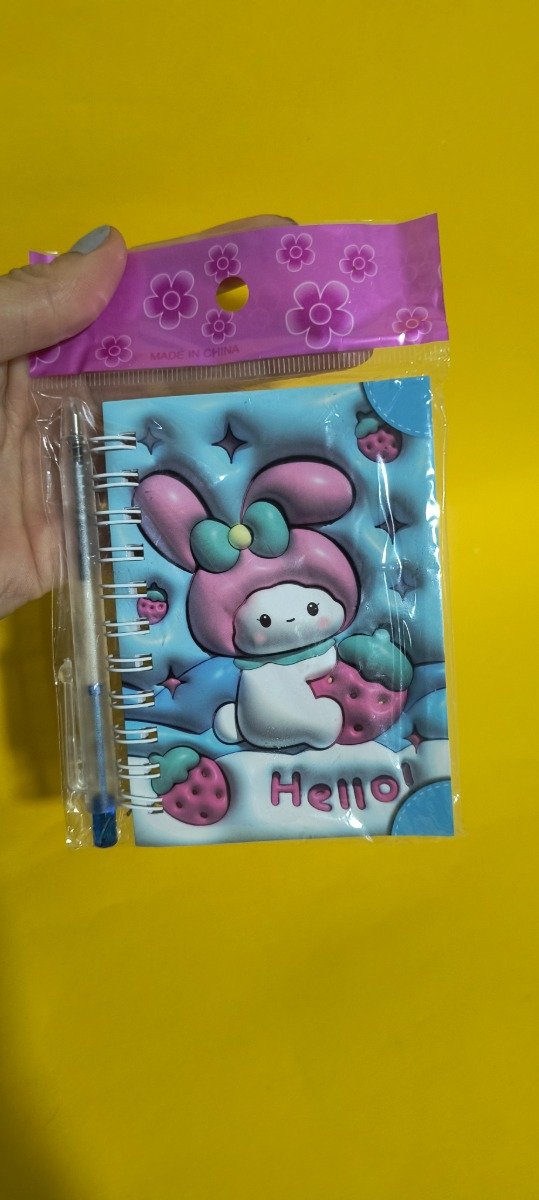 Producto - Mini libreta con birome My melody   hojas rayadas ( 38 h aprox - 7.5 x 10.5 cm)