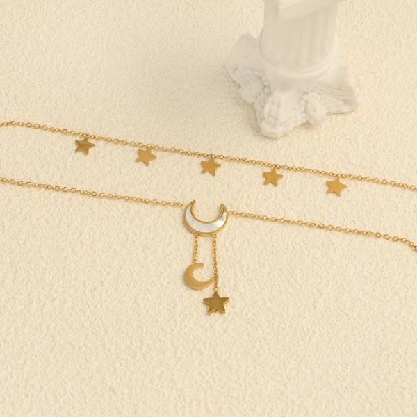 Producto - Tobillera multicapa dorada con dijes lunas y estrellas - 1