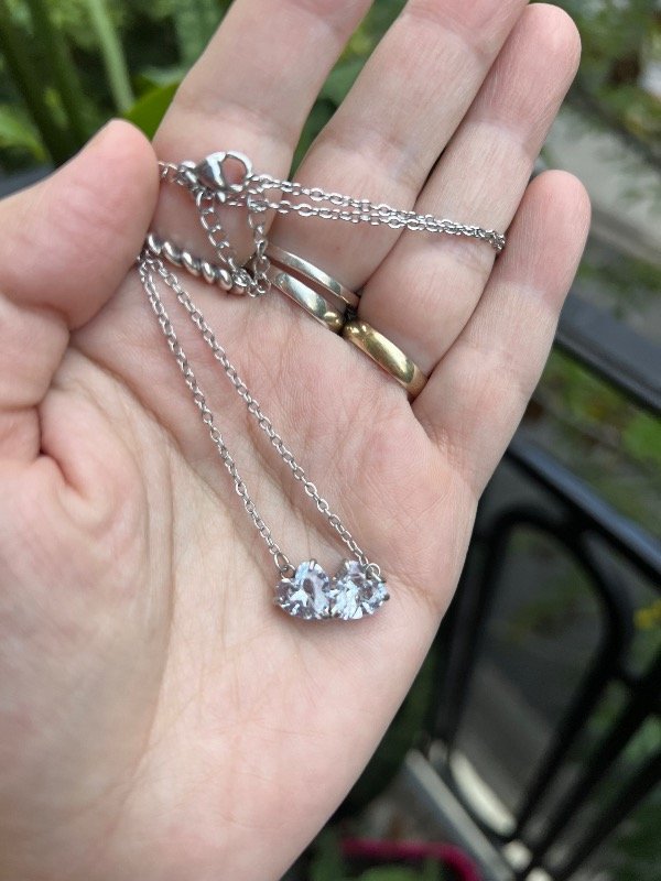 Producto - 2 collares de acero con dos corazones unidos