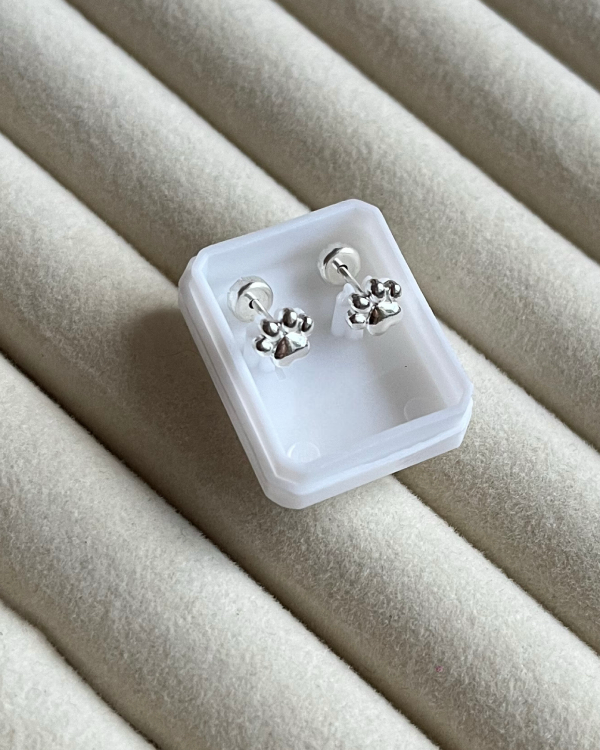 Producto - Aros abridores huellitas de acero blanco 5mmd