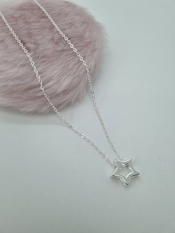Producto - Cadena acero blanco dije estrella calada inflada pasante