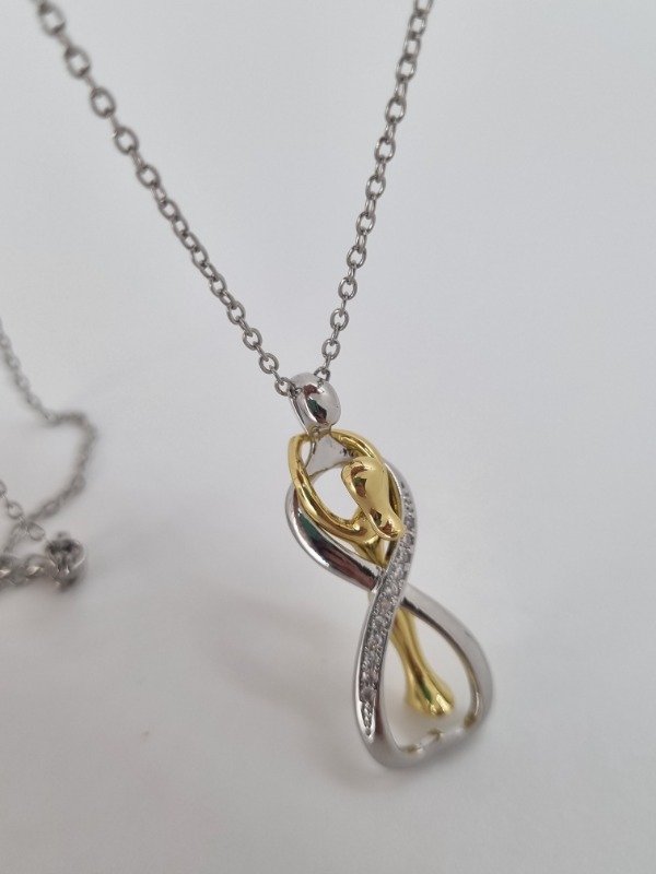 Producto - Cadenita acero quirúrgico dije infinito strass abrazo eterno con dorado