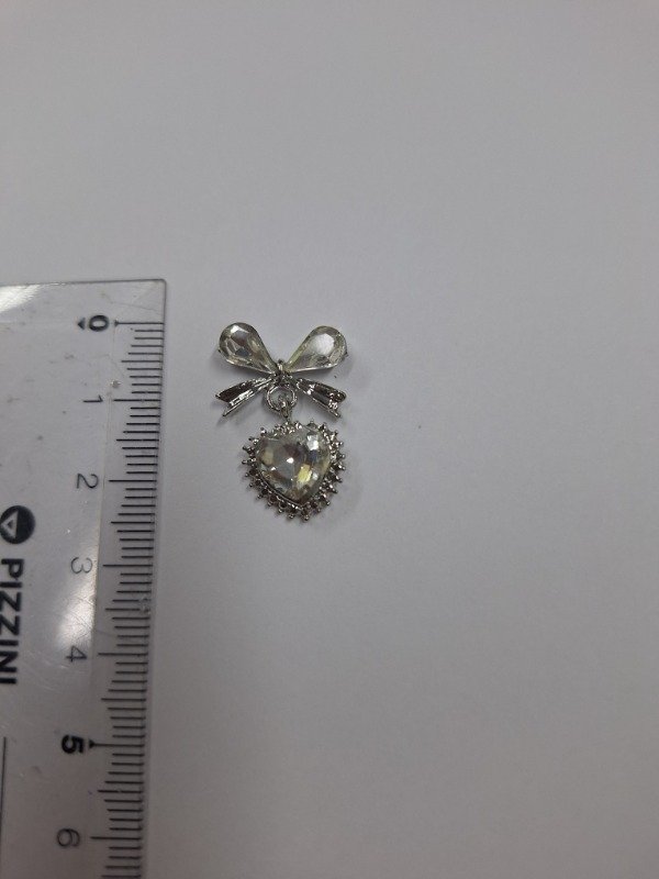 Producto - Dije moño y corazon colgante  x 1