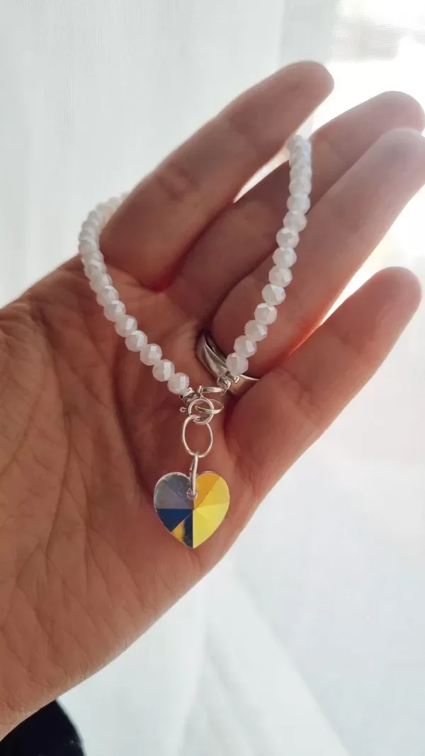 Producto - Pulsera blanca con corazon tornasol plata 925