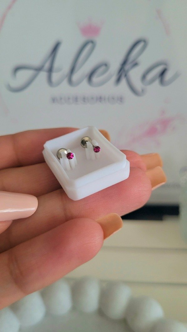 Producto - Abridor chispa fucsia de acero quirúrgico