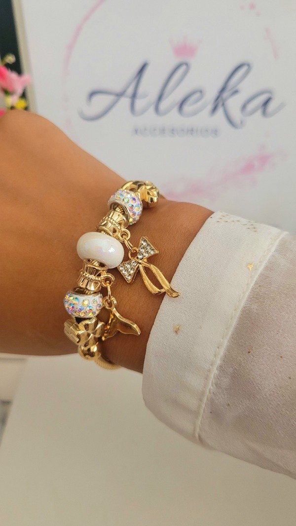 Producto - Pulsera esclava regulable charm moño de acero dorado