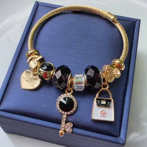 Producto - Brazalete acero dorado detalles en negro
