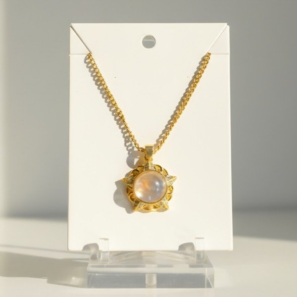 Producto - Dije estrella dorada con perla iridiscente collar en acero