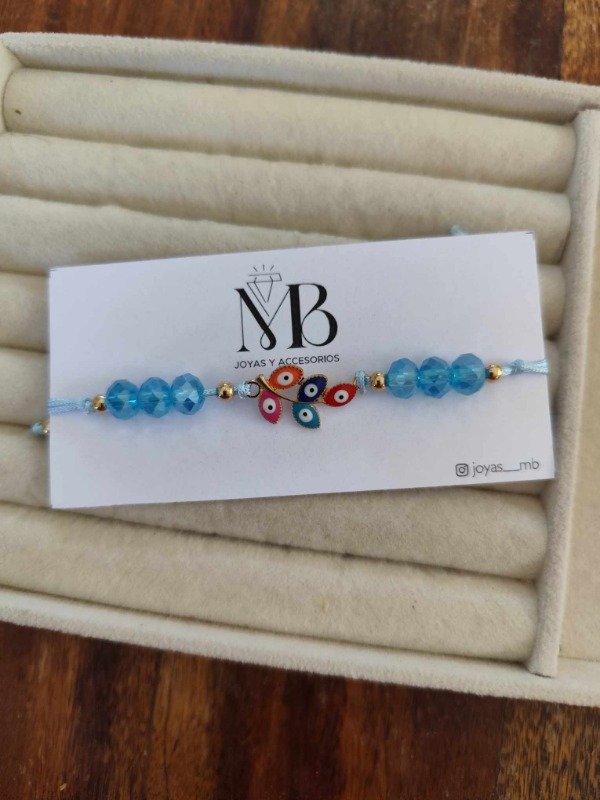 Producto - Pulsera ramitas y ojitos celeste.