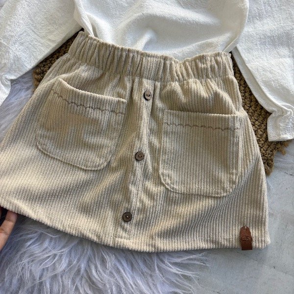 Producto - Pollera en color beige línea bebas hasta 4 años