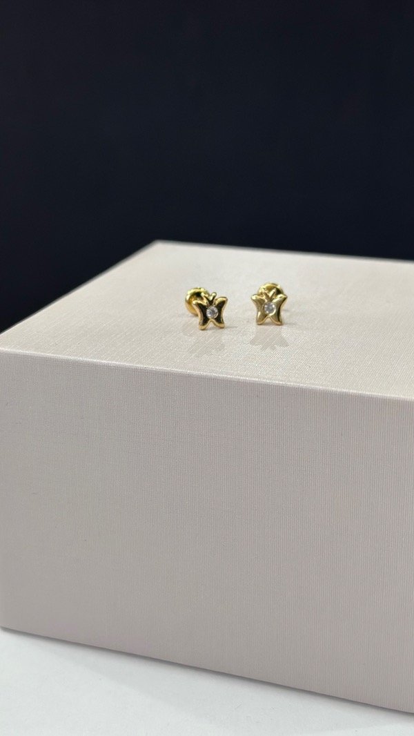 Producto - Abridor mariposa con punto de luz en medio laminado en oro 18k