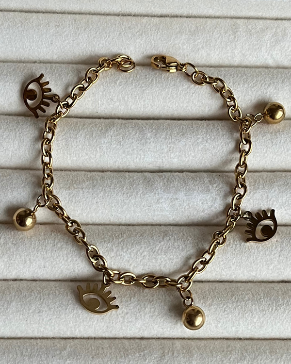 Producto - Pulsera con dijes ojito y bolitas de acero dorado 18cm