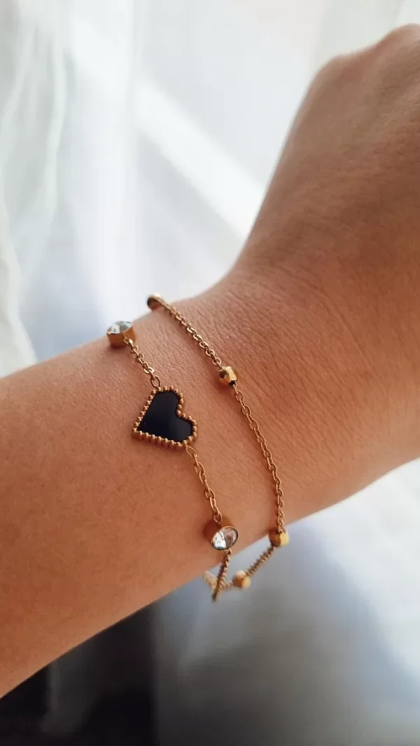 Producto - Pulsera doble corazon negro con bolitas y susanitos Ad