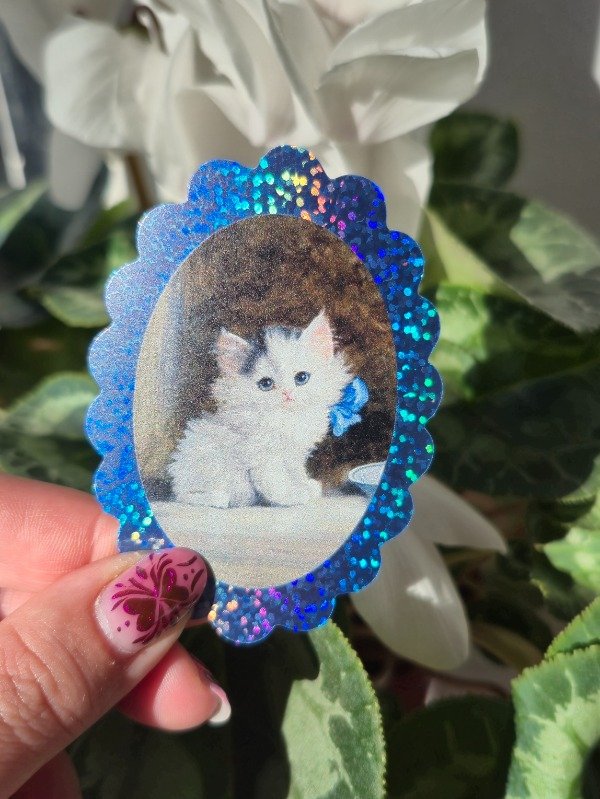 Producto - Gatito moño celeste