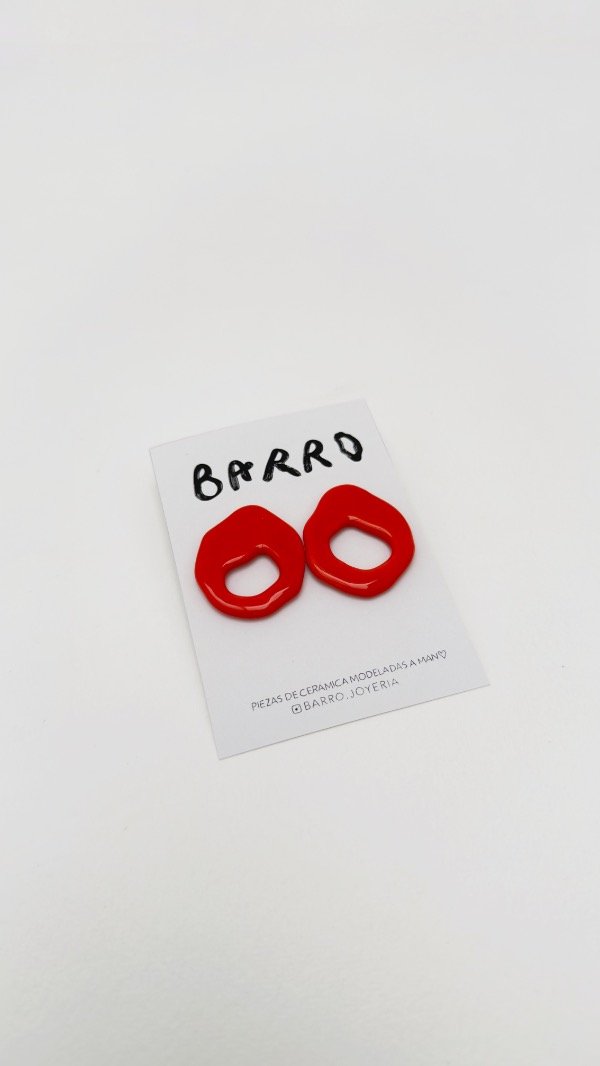 Producto - Arete naranja perforado
