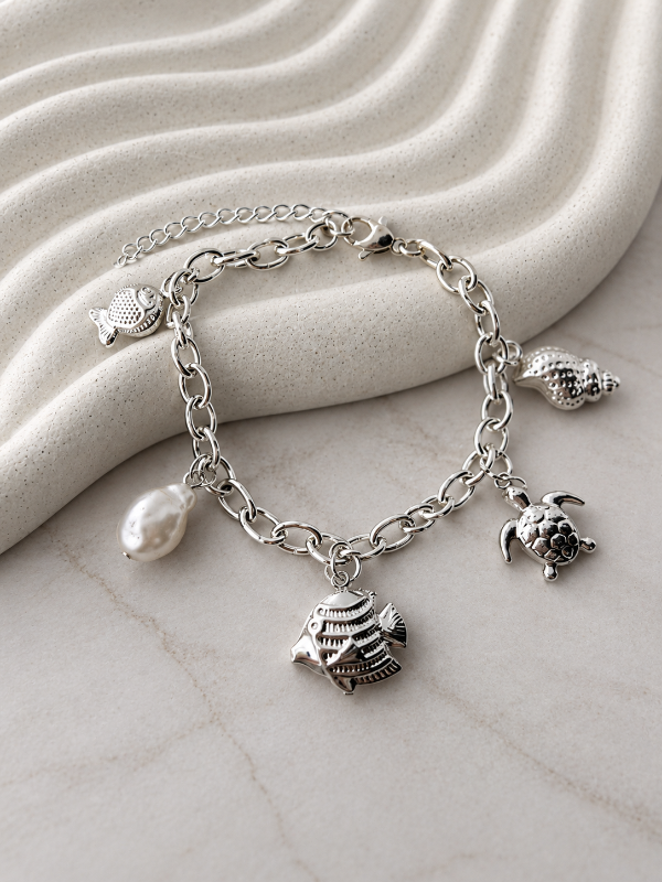 Producto - PULSERA CON PERLA Y DIJES 0040