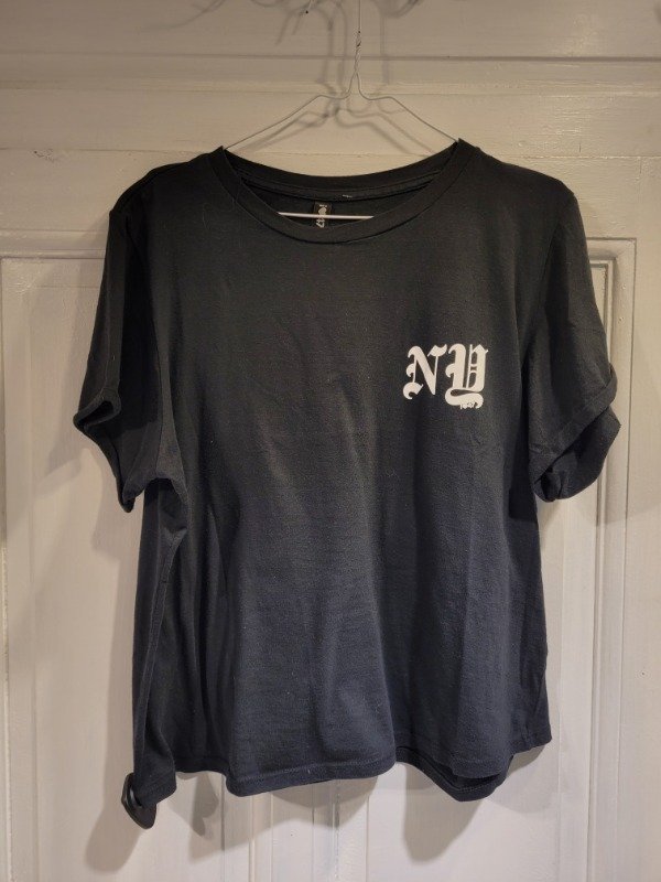 Producto - Remera 47 STREET negra frente/espalda blanco y margaritas-Talle S/M-PRECIO: 18X - 0