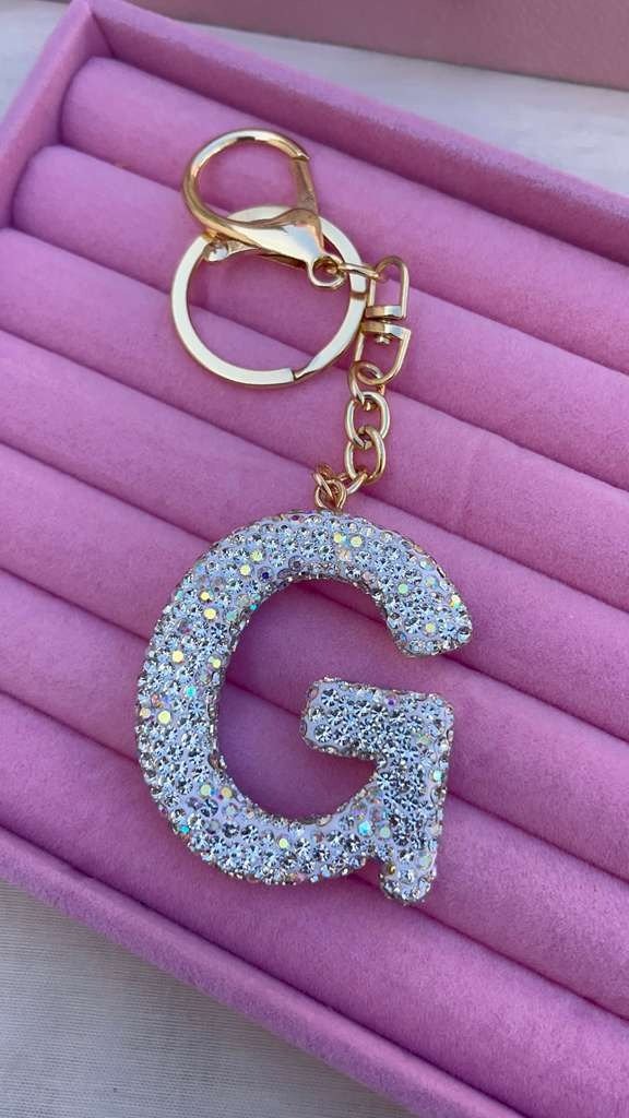 Producto - Llavero inicial brillante "G"  tornasol